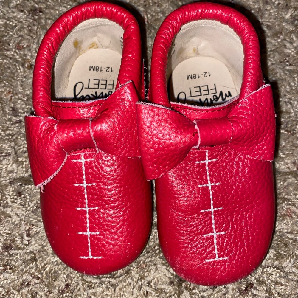 Red football bow moccasin style leather monkey feet brand hard bottom
